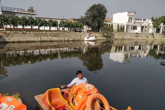 person sitting in a boat at the lake