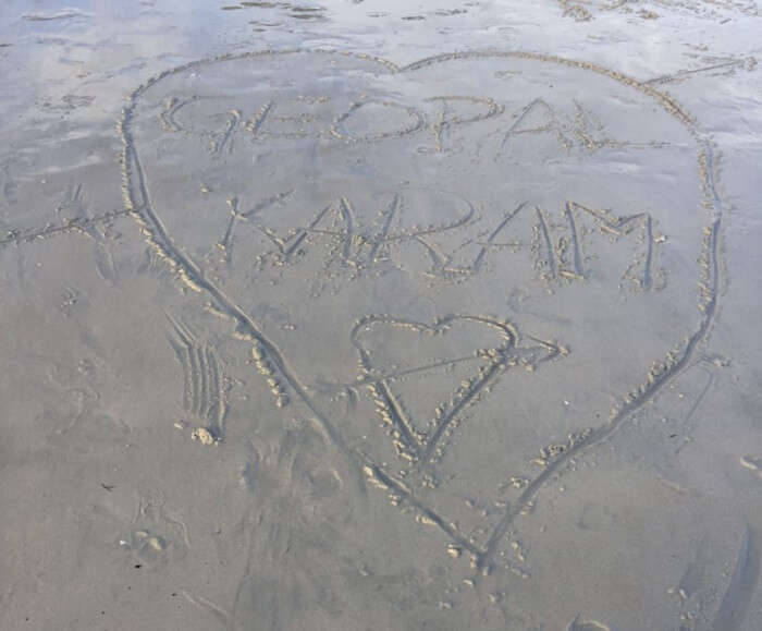 writing names on the beach