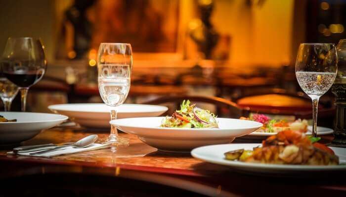 restaurant table with drinks and dishes