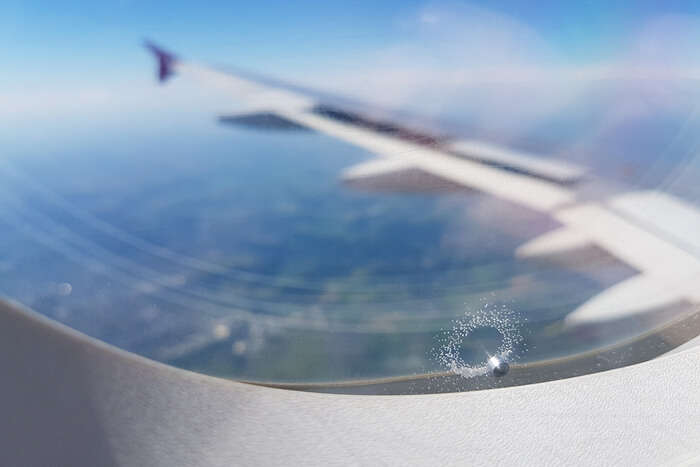 pressure release hole in airplane window