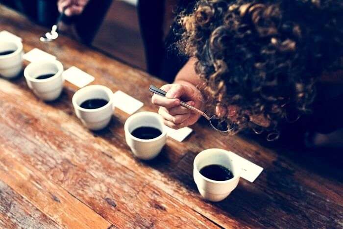 woman tasting coffee