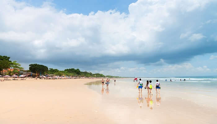 people walking at the beach in Bali