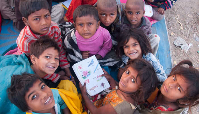 Kids smiling into the camera