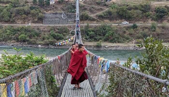 monks on the suspension bridge