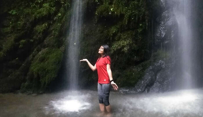 under the refreshing waterfall