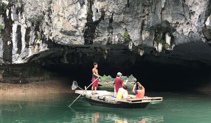  explore the limestone caves at Halong Bay
