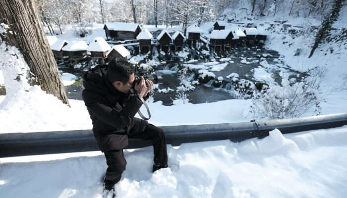 photographer capturing snowfall