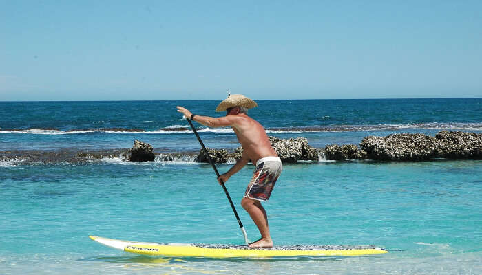 man doing standup paddle boarding