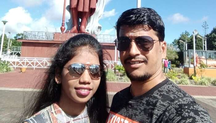 standing at the Shiv statue in Mauritius