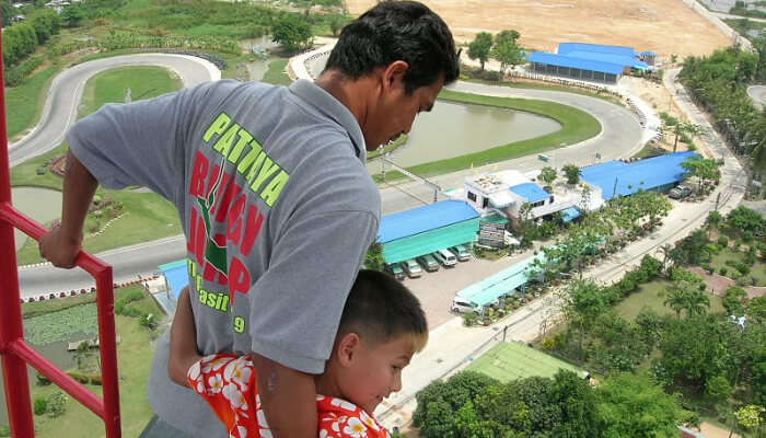A bungee instructor instructing a child