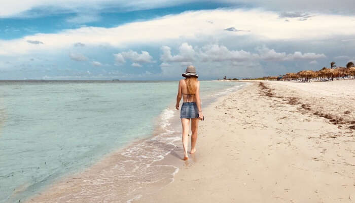 woman strolling around the beach