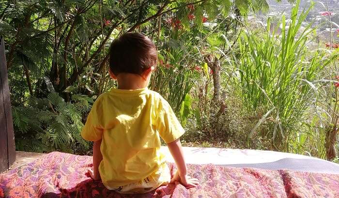 kid is sitting and chilling this moment