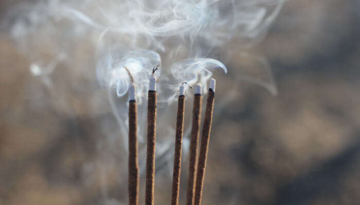 Burning incense sticks for prayer