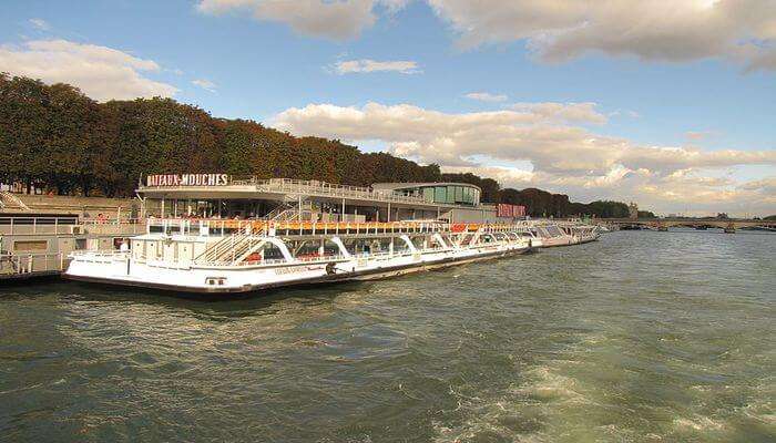 take a river cruise in the Seine river in Paris