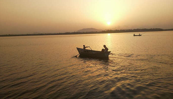 Sunset and Boat in a Lake