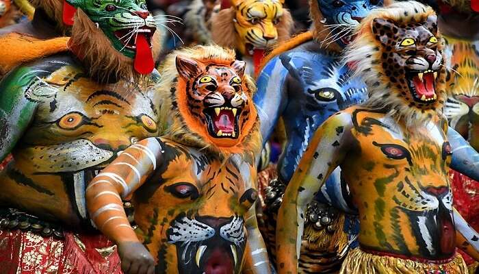 see the Pulikali dance