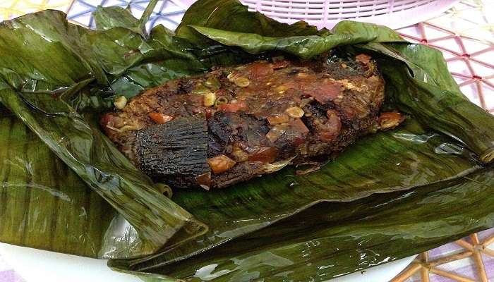 Karimeen Ilayil pollichath, a famous dish to try.