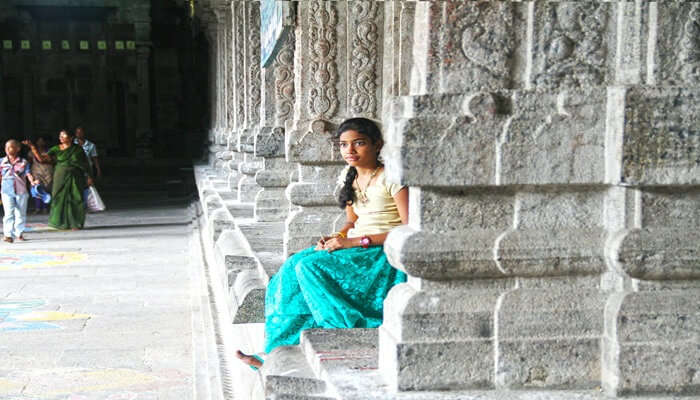 A girl sitting in a temple in Malappuram.