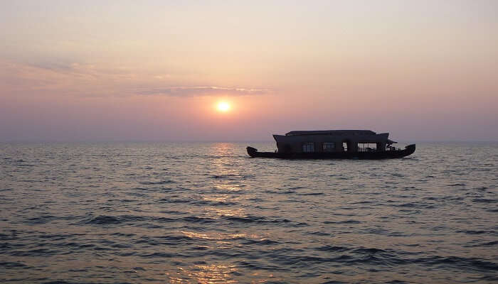 Alleppey honeymoon houseboat enjoying sunset