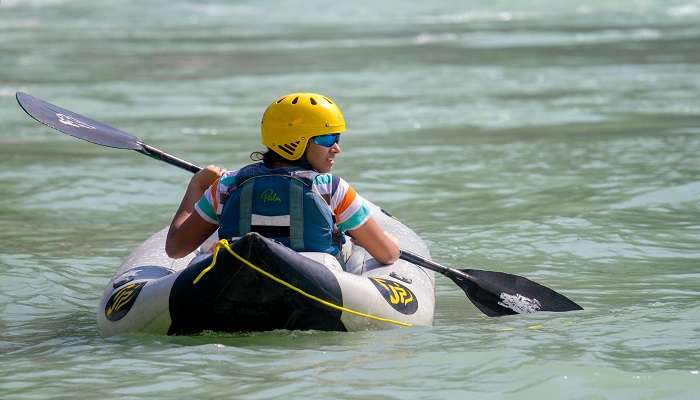 A group of people doing River rafting