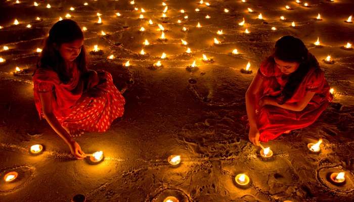 candle and clay lamp in their house Diwali Celebration In India