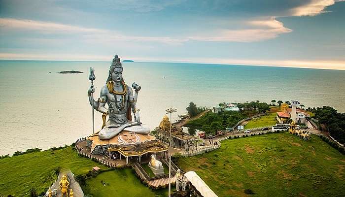 Pictured here is a giant Shiva statue of Murdeshwar, one of the best places to visit in Karnataka.