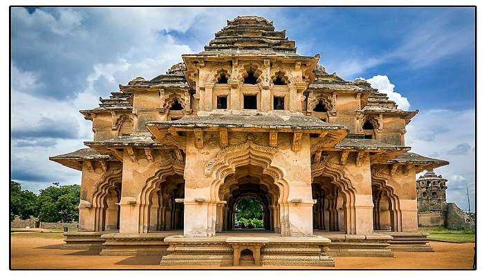 enjoy the breathtaking view of the stone structure at Hampi which is one of the best places to visit in Karnataka.