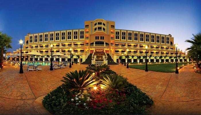 A massive Hotel in Gazia, Egypt, with a gloomy lighting effect and grand entrance. 