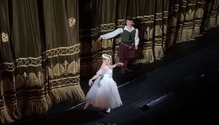 artist preparing themselves for ballet performance 