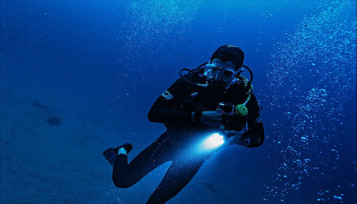 Someone exploring adventure sports in Kerala underwater.