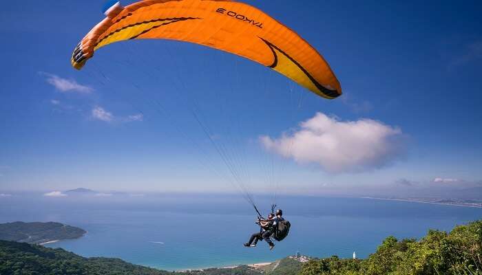Someone experiencing adventure sports in Kerala with a certified instructor.