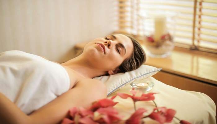 Woman experiencing the spa treatment in Kerala