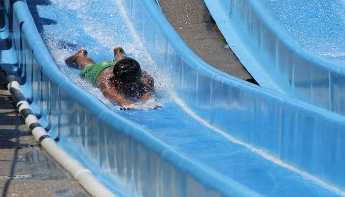 A boy playing on a slide