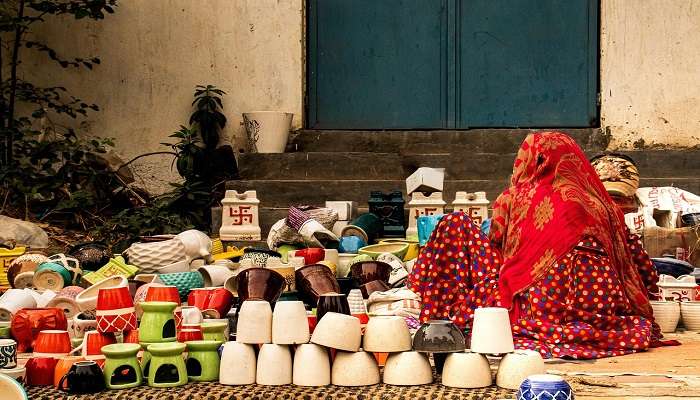 A woman selling ceramic products