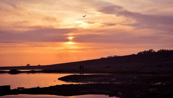 Catch a prominent sunset at Nyari Dam in Rajkot