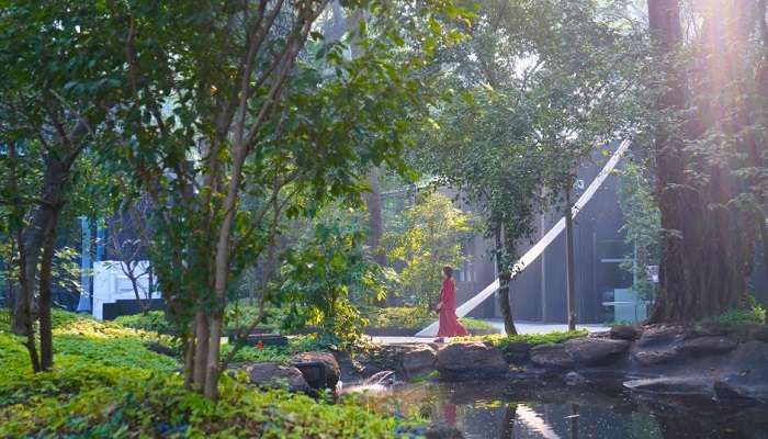 A monk’s statue signifies the peace and romanticism of Osho Garden in Pune