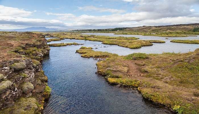 Snorkeling between the tectonic plates in Silfra fissure, Iceland