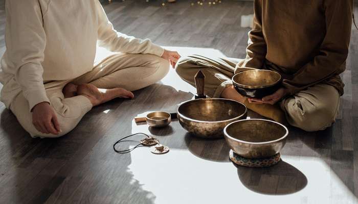 An image of someone embracing themselves in spiritual healing.