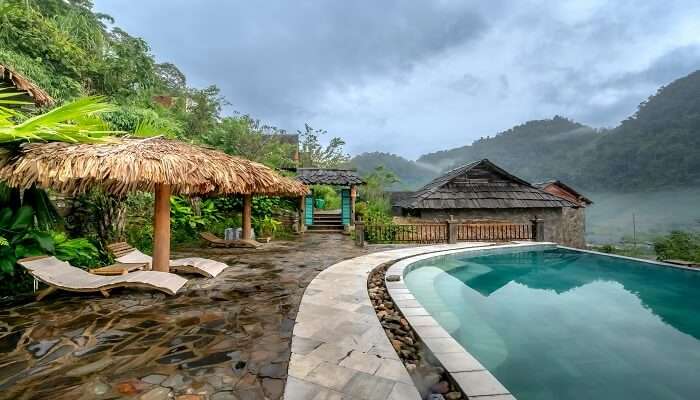 Luxury resort stay near Athirapally Falls with rainforest views.