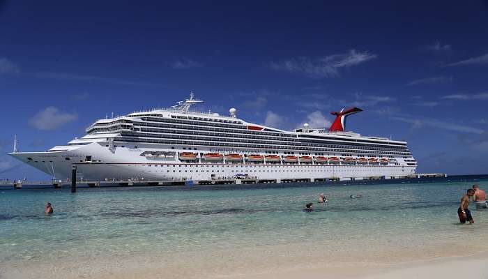 A Cruise Ship Seen from a Beach