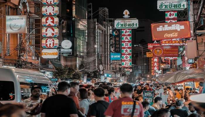 A Crowded Street with Illuminated Sings in Bangkok, Thailand