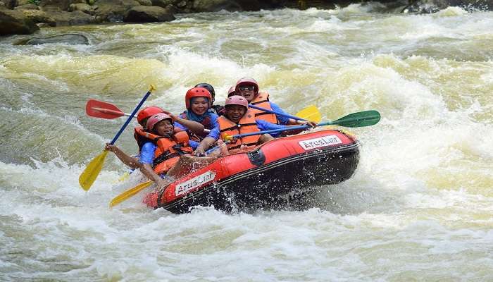 Group of People Whitewater Rafting