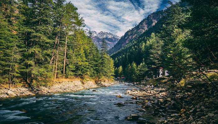 A beautiful view of a river flowing through a valley in Himachal Pradesh
