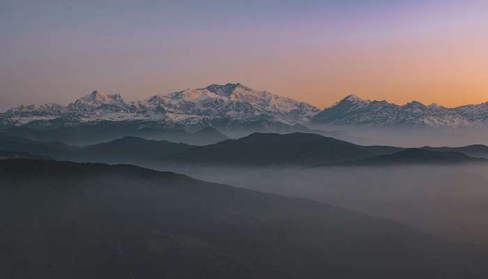 Mount Kanchenjunga covered by thick fog