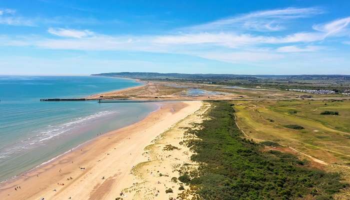 Witness the charm of Camber Sands, one of the best beaches near London