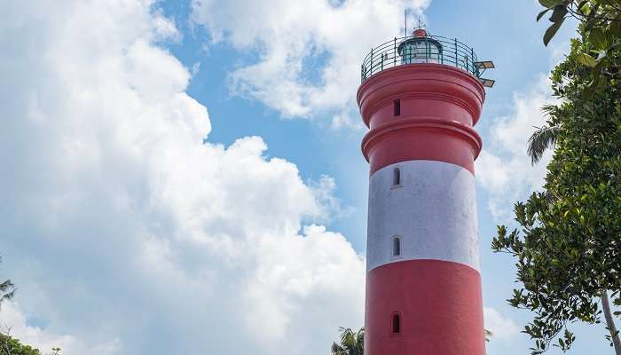 Sagar Lighthouse with red and white stripes, one of the best places to visit in Gangasagar