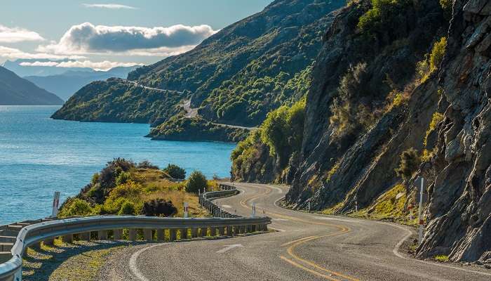 A panoramic view of the road along one of the best cities to visit in New Zealand