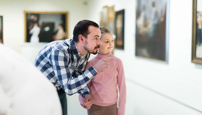 Father and daughter in this Sharjah Museum, reflecting the authentic Emirati architectural style.