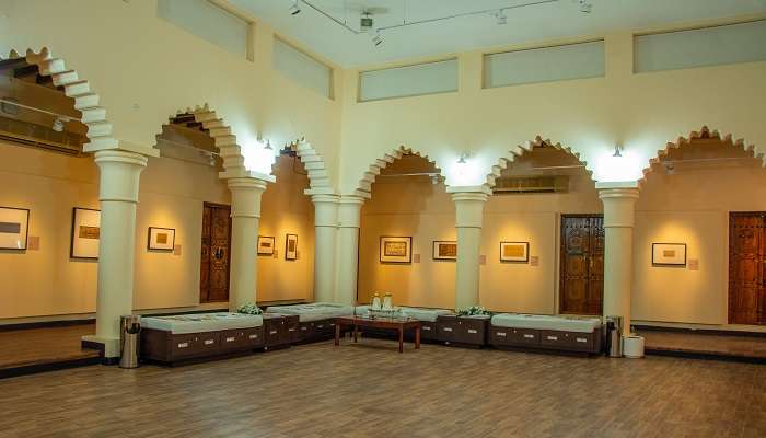 The inside of Sharjah Calligraphy Museum, with a traditional sitting area.