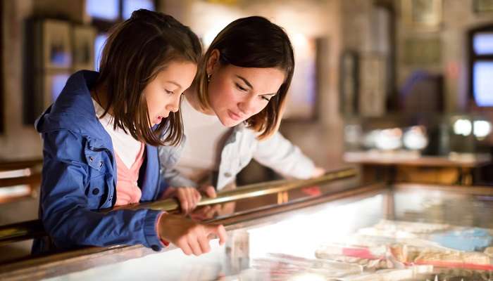 Mother and daughter exploring the view of Sharjah Natural History and Botanical Garden.